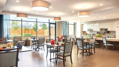 Bright dining area with tables set for meals
