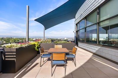 Outdoor patio area with seating and plants