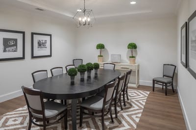 Elegant dining room setup with table and chairs