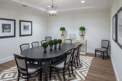 Modern common area with a dining table and decor