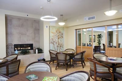 Interior view of a common area with seating and a fireplace