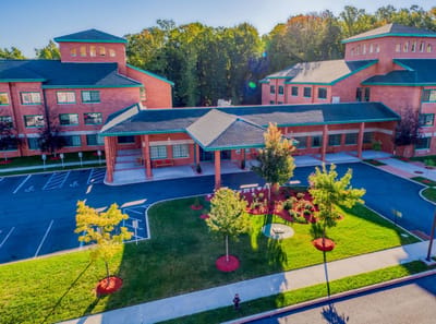 Aerial view of the facility with landscaped grounds