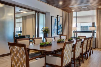 Bright dining room with a large table and chairs
