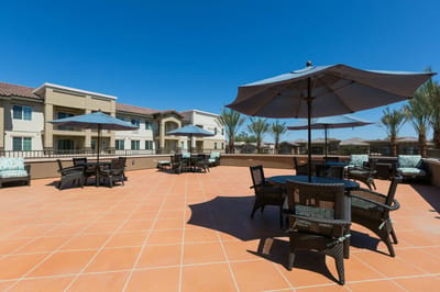 Outdoor patio area with umbrellas and seating