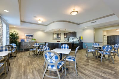 Interior view of a dining area with tables and chairs