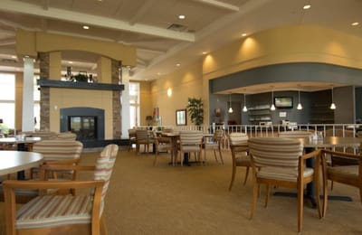 Bright dining room with comfortable seating and large windows