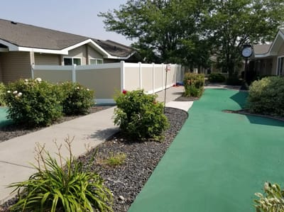 Well-maintained outdoor walking path with greenery