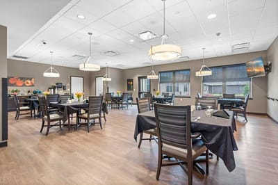 Bright dining area with tables and chairs