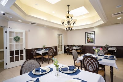 Dining room with tables set for guests