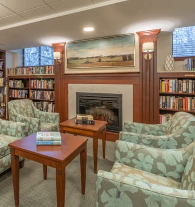 Cozy common area with seating and bookshelves