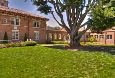 Exterior view of a senior living facility with landscaping