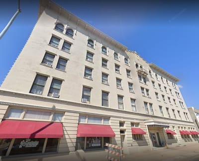 Exterior view of The Kensington Beatrice with awnings