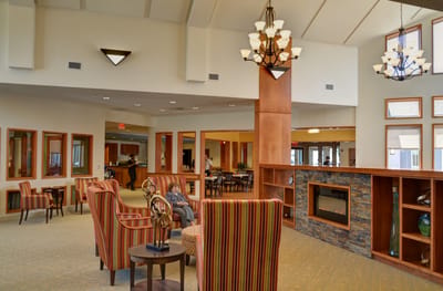 Interior lobby of a senior living facility with seating