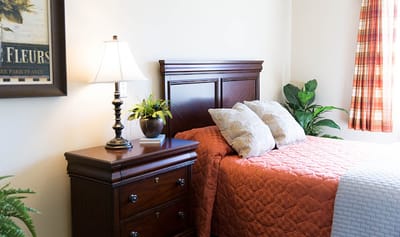 Cozy private room with a bed and nightstand