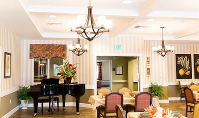 Interior of a common area with a piano and decor