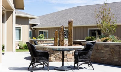 Outdoor seating area with a water feature