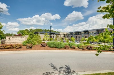 Exterior view of The Reserve at Mills Farm with landscaping