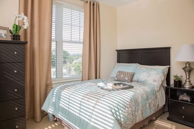 Cozy resident room with bed and furnishings