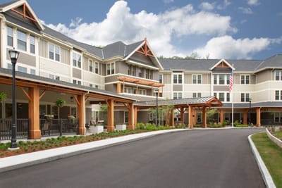 Exterior view of a senior living facility with a driveway