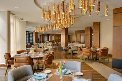 Bright dining area with modern lighting and decor