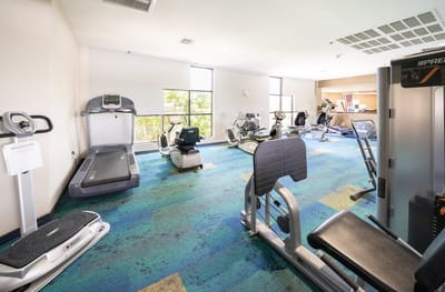 Interior view of a fitness room with exercise equipment