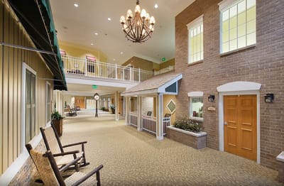 Common area with seating and decor in a senior facility