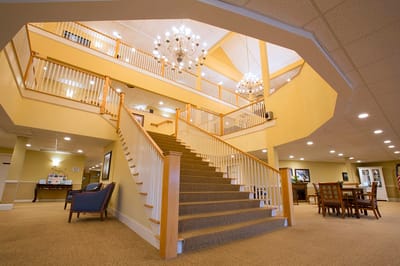 Interior of a bright staircase with chandeliers