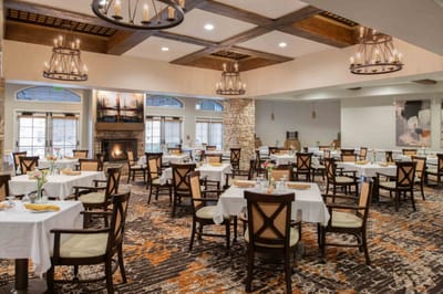 Dining area with tables set for meals.