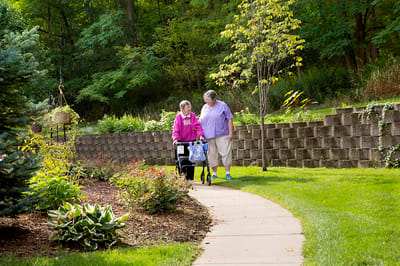 Residents walking together on a garden path