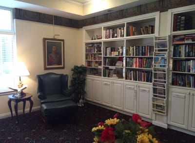Cozy reading area with bookshelves and comfortable chair