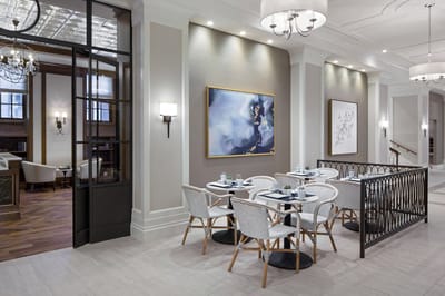 Dining area with elegant decor and tables set
