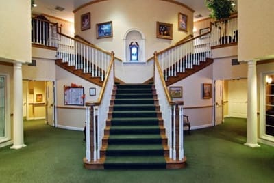 Interior view of a facility's lobby with staircase