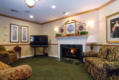 Cozy common area with seating and a fireplace