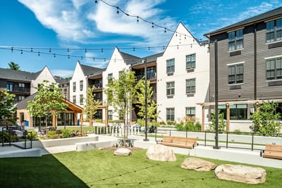 Outdoor courtyard with landscaped area and seating