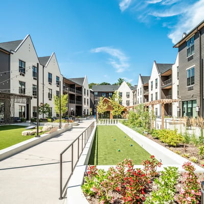 Outdoor courtyard with green space and landscaping
