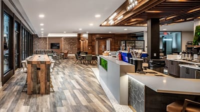 Modern common area with seating and coffee bar