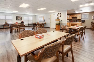 Bright common area with tables and chairs