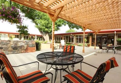 Outdoor seating area with shaded pergola