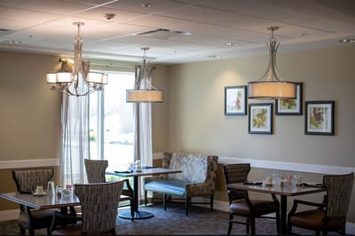 Bright dining room with tables and artwork