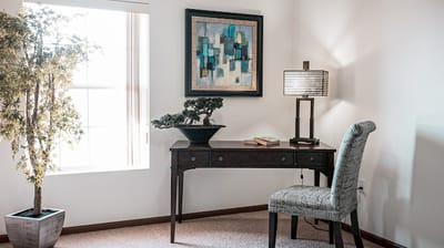 A cozy corner of a senior living room with decor