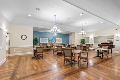 Dining area with tables and chairs in a common room