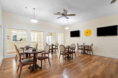 Bright and inviting dining area with tables and decor