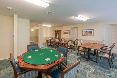 Interior view of a gaming room with card tables