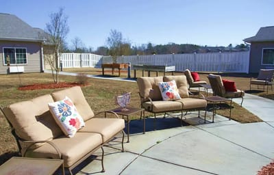 Outdoor seating area with lounge chairs and cushions