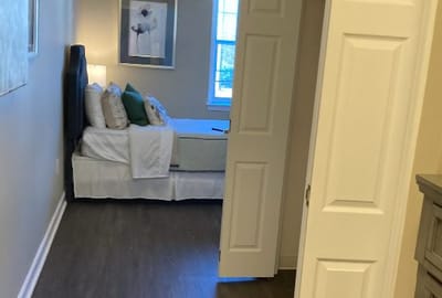 View of a private resident room with a bed and decor