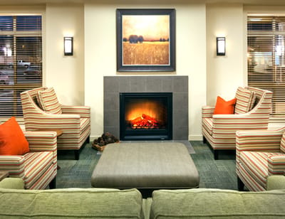 Cozy common area with seating and a fireplace