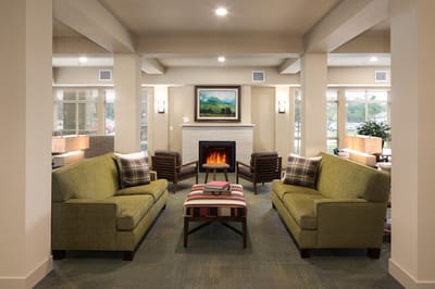 Cozy lounge area with comfortable seating and fireplace