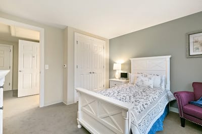 Cozy private room with white furniture and soft decor