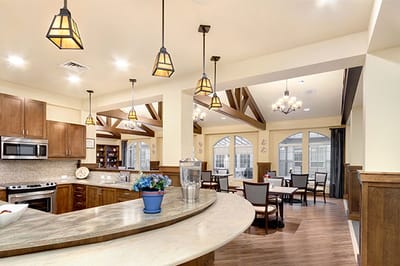 Bright common area with seating and dining tables