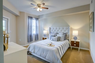 Cozy bedroom with a bed, bedside tables, and natural light